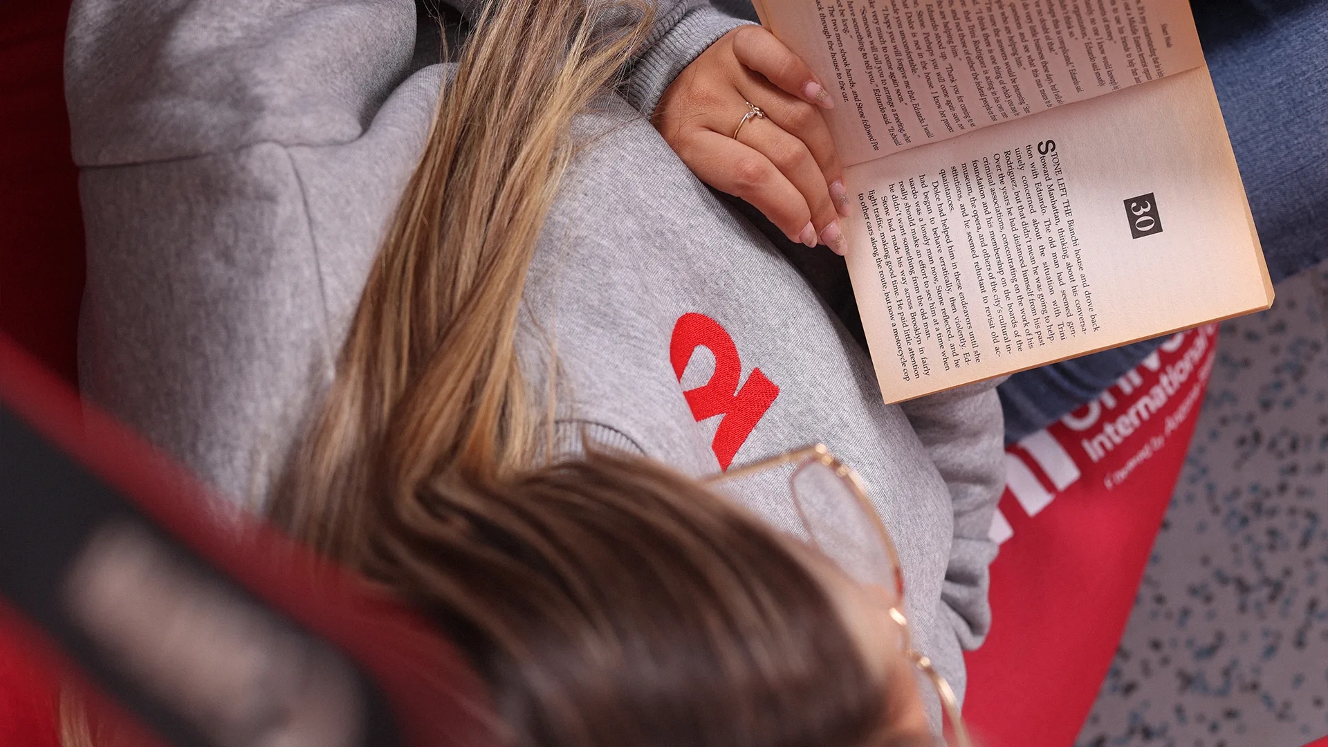 Kids studying and having fun in a university table.